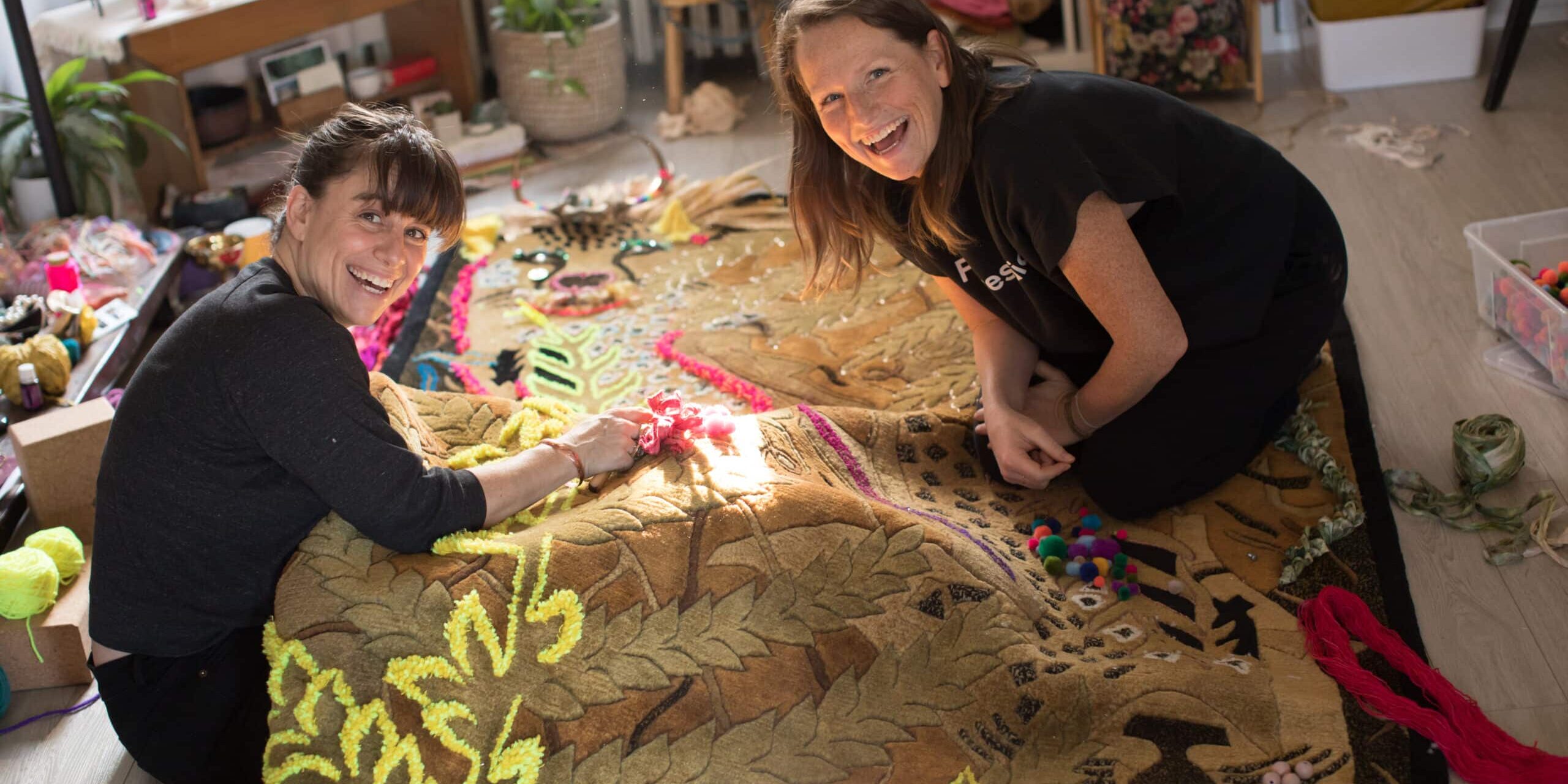 Marina Dempster and Nikki McKean collaborating on carpet installation for Piano Piano Colborne Street